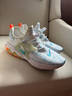 Nike Kids Sneakers in White with Light Blue and Orange Accents